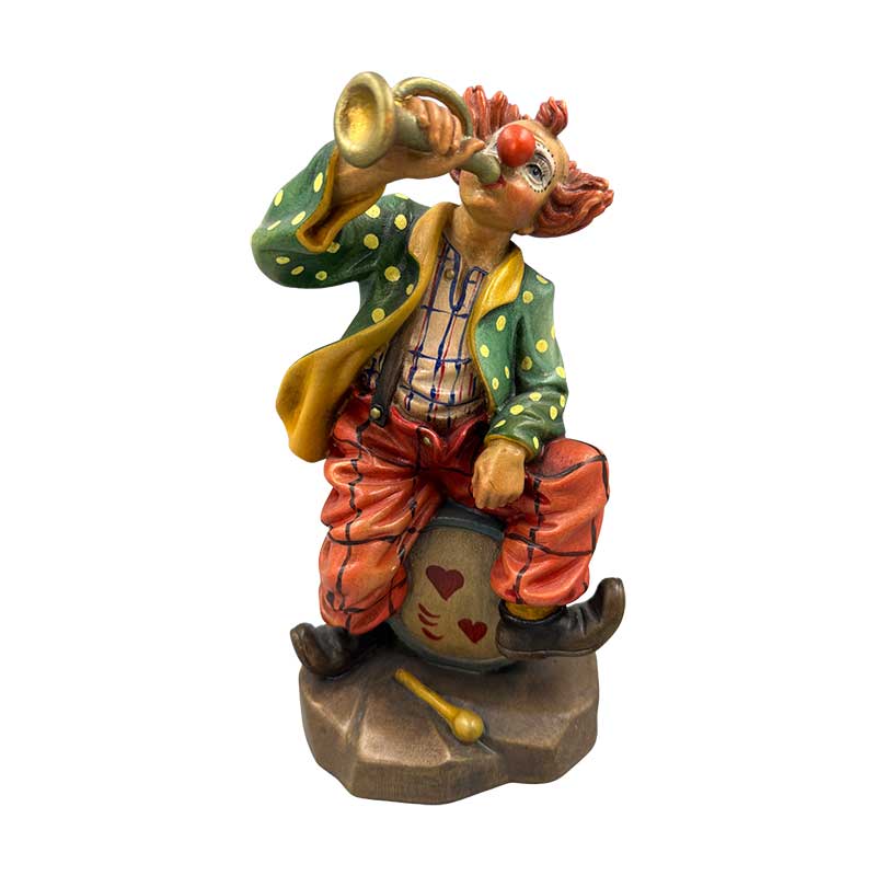 Clown auf Trommel sitzend
