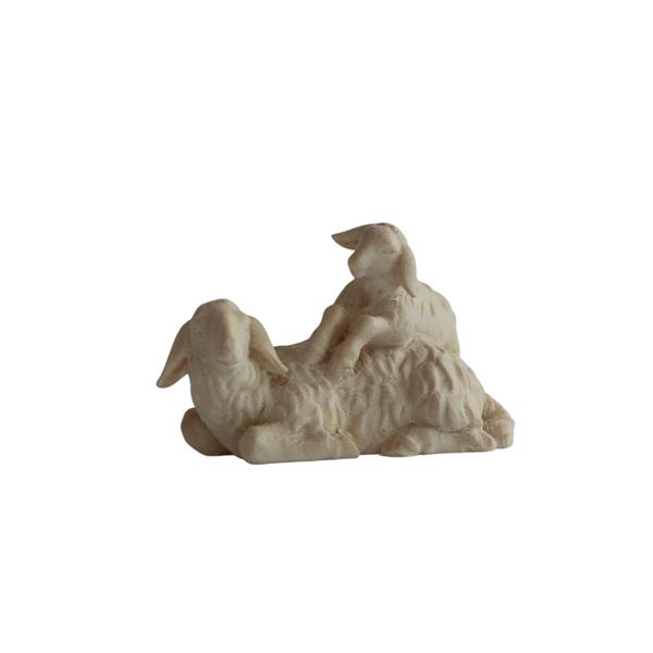 Schaf hockend mit Lamm Schaf hockend mit Lamm