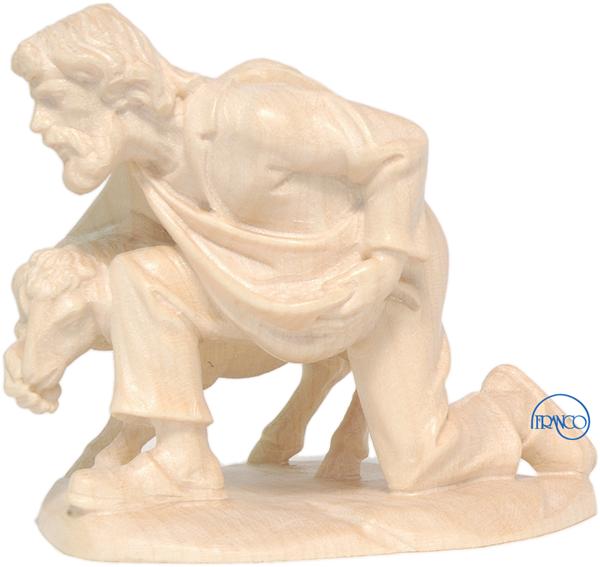 Hirte kniend mit Schaf Hirte kniend mit Schaf