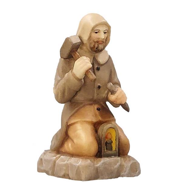 Berghäuer kniend mit Hammer und Meisel