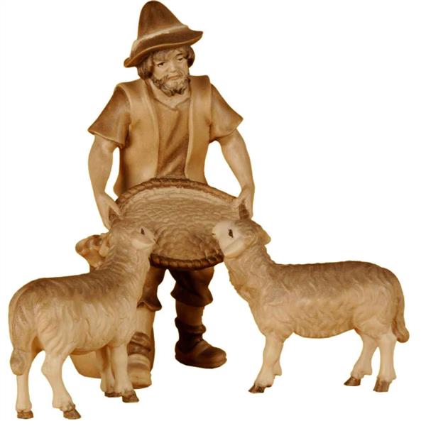 Schaffütterer mit zwei Schafen