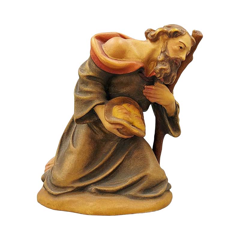 Hirt kniend mit Stock Hirt kniend mit Stock